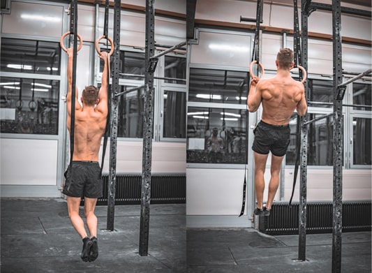 athlete does pull up exercises on rings