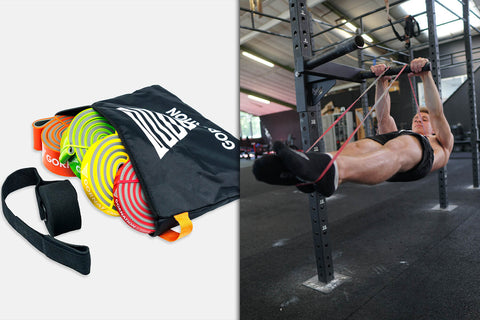 athlete holding front lever with resistance bands