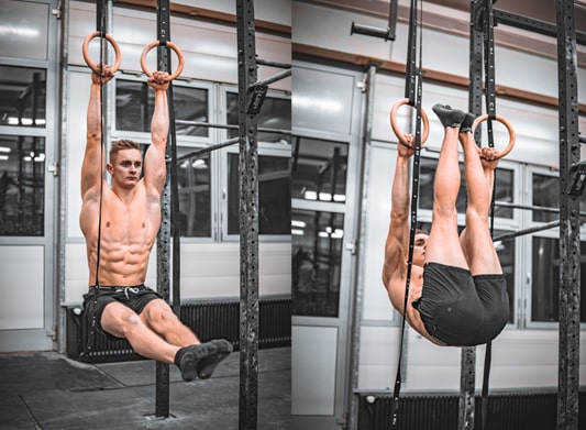 athlete is doing ab exercises on workout rings