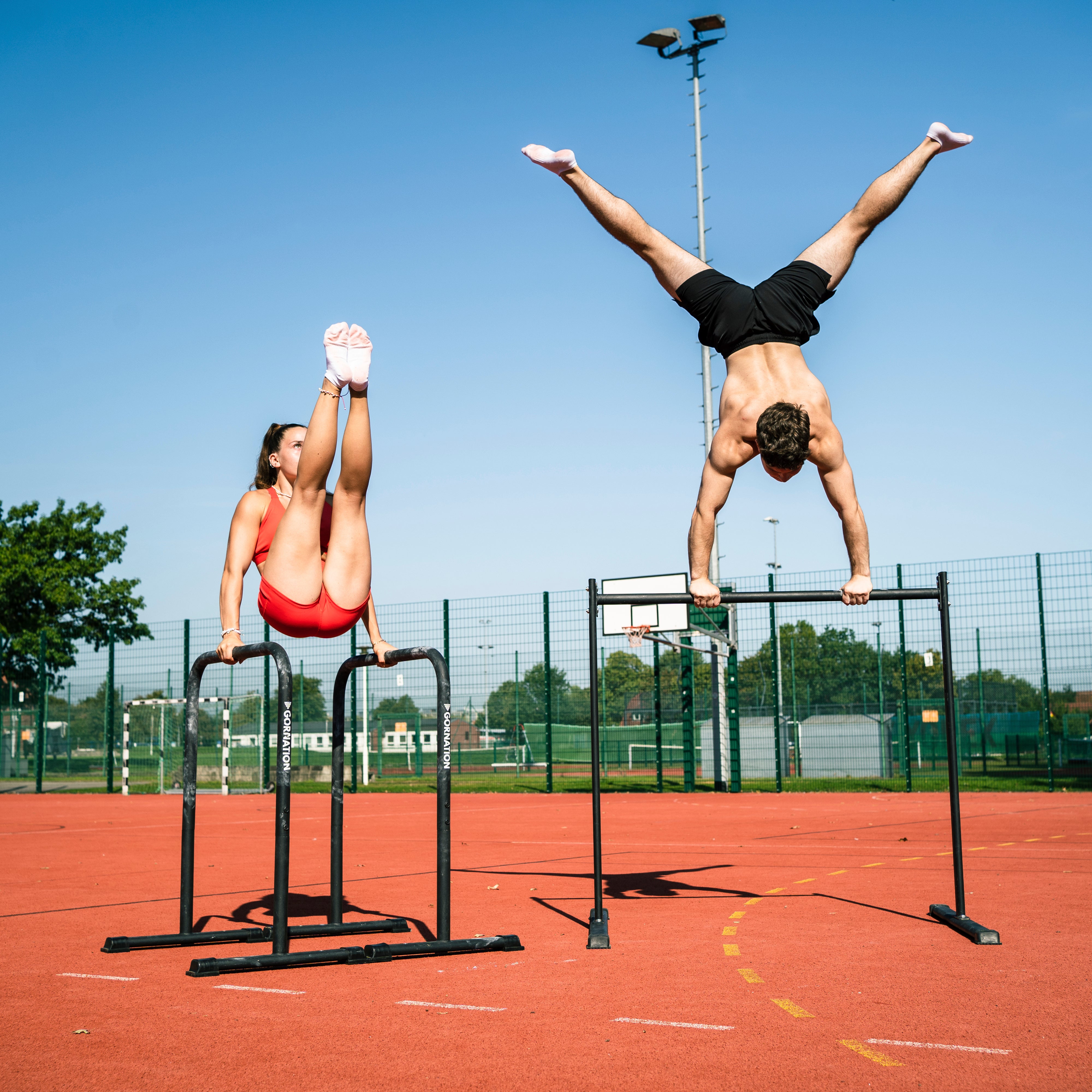 yehor and jasi doing calisthenics skills von static bar and dip bars by gornation