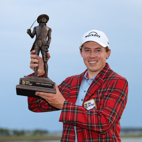 Matt Fitzpatrick holding trophy after winning RBC Heritage 