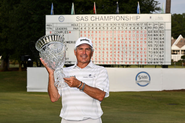 Fred Couples Holding up Trophy at SAS Championship