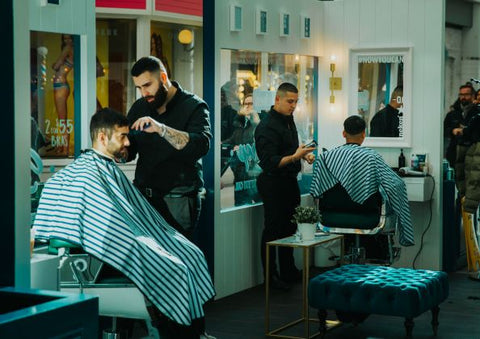 Joshua Dos Santos and Claudio Ferreira Fade at the Heineken 00 barbershop popup event in Toronto's Eaton Centre