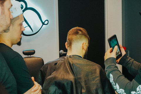 Scott Ramos and Claudio Ferreira look and learn barber class