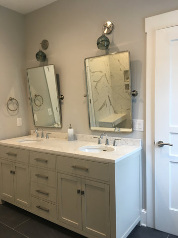 Bicycle Glass Swell 763 Wall Sconces in Gray with Brushed Nickel Hardware, bathroom lights over mirror and two sink vanity, lights off 