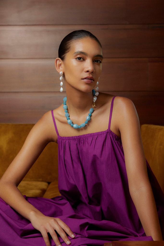 Model wearing turquoise jewelry