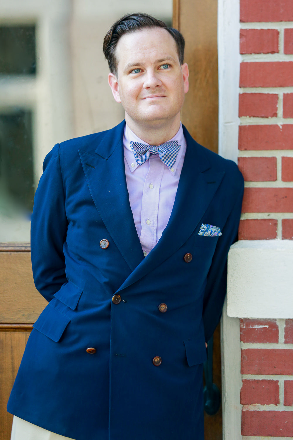 Patrick in blue jacket with bowtie