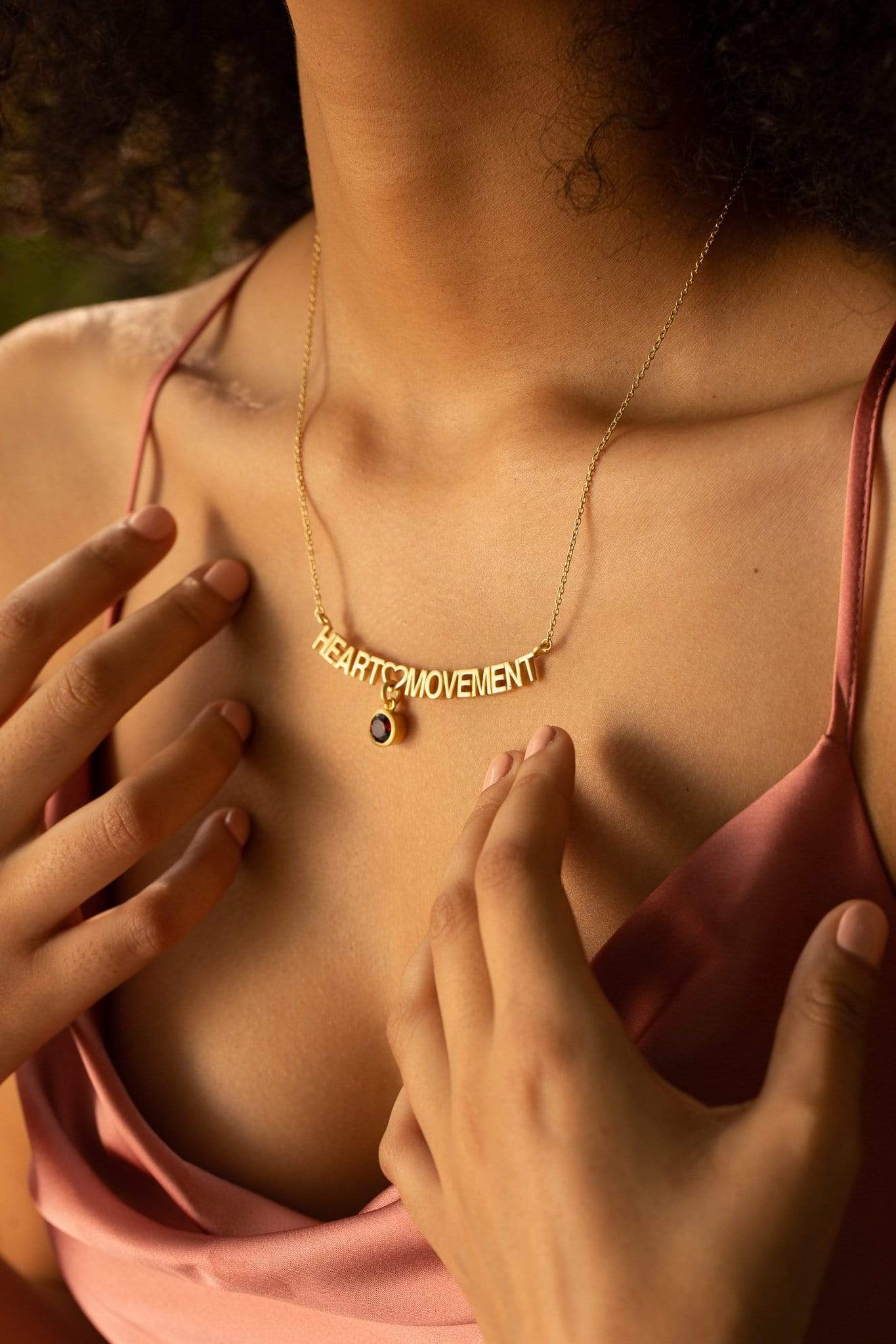 Heart Movement Necklace in Matte Gold / Red Garnet