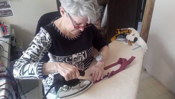 Independent seamstress making swimwear