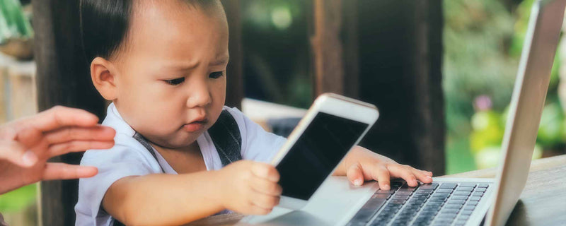 Toddler with computers