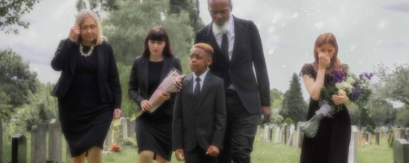 Family visiting grave