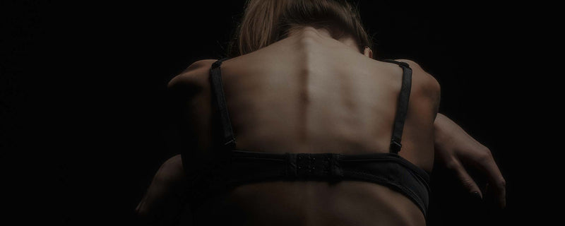 Female back in darkness