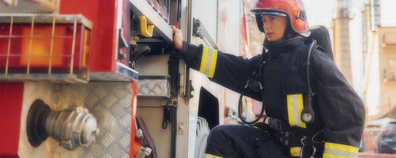 Female firefighter with truck
