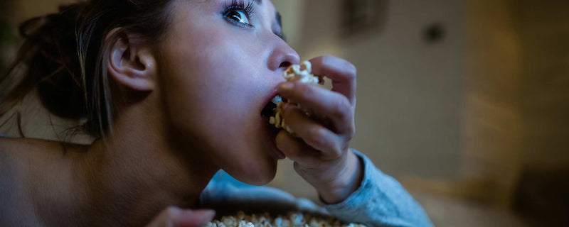 Female eating popcorn