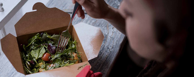 Female eating healthy salad