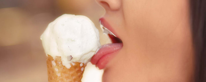 Female licks ice cream