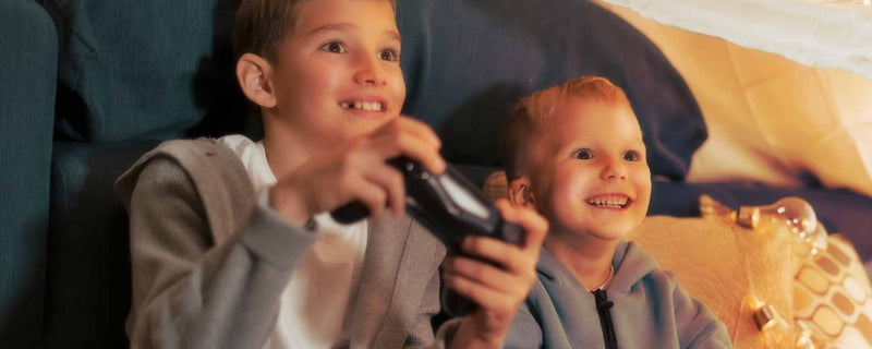 Kids with video game consoles