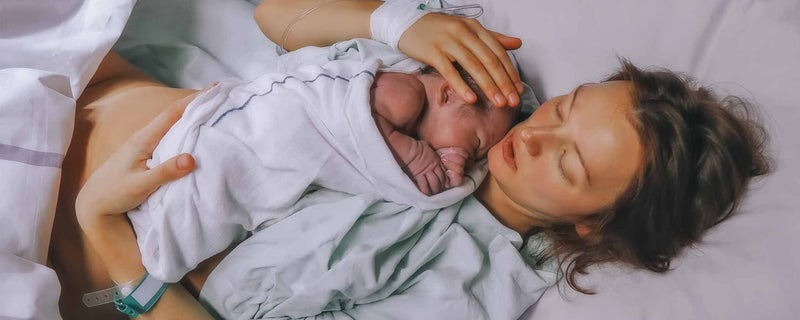 Mother holding newborn