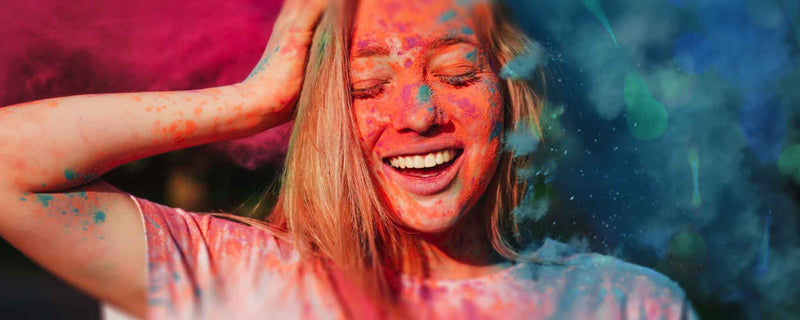 Woman covered in colorful powder