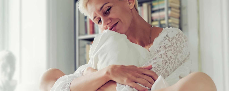 Woman hugging pillow