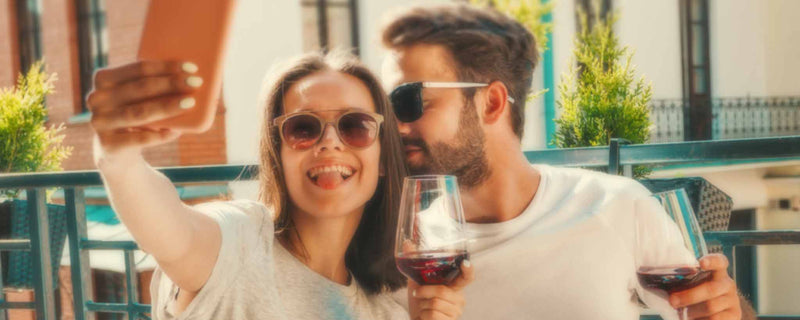 Selfie couple wine glasses