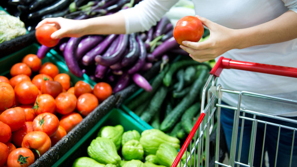 Person shopping for vegetables at a store