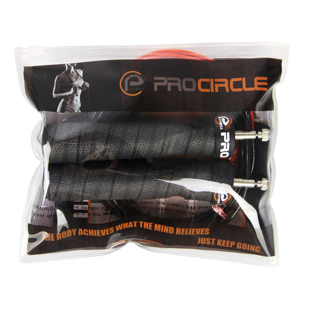 corde à sauter PROCIRCLE noire + fil de corde de rechange rouge + sac de transport, dans leur emballage