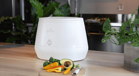 Lomi Smart Kitchen Composter on a kitchen countertop.