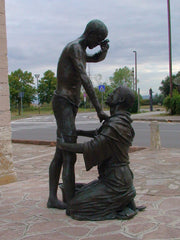 Statue of Francis with a leper at Rivotorto