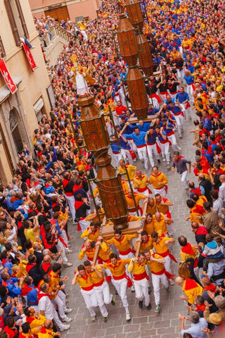 Three teams shoulder giant ceri and run through the streets and up to the basilica of Sant-Ubaldo.