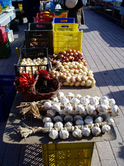 Plaited garlic and onions at an Italian market