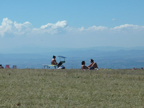 Sunbathers on the top of Monte Subasio, Umbria.