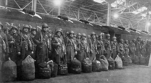 Gi's awaiting transfer to a train, which are equipped with two models of Duffle Bags