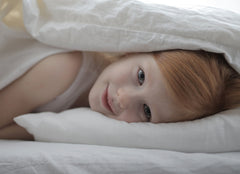 Girl hiding in bed Luna Luxury