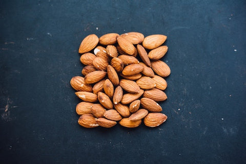 Almonds arranged in a square on a table