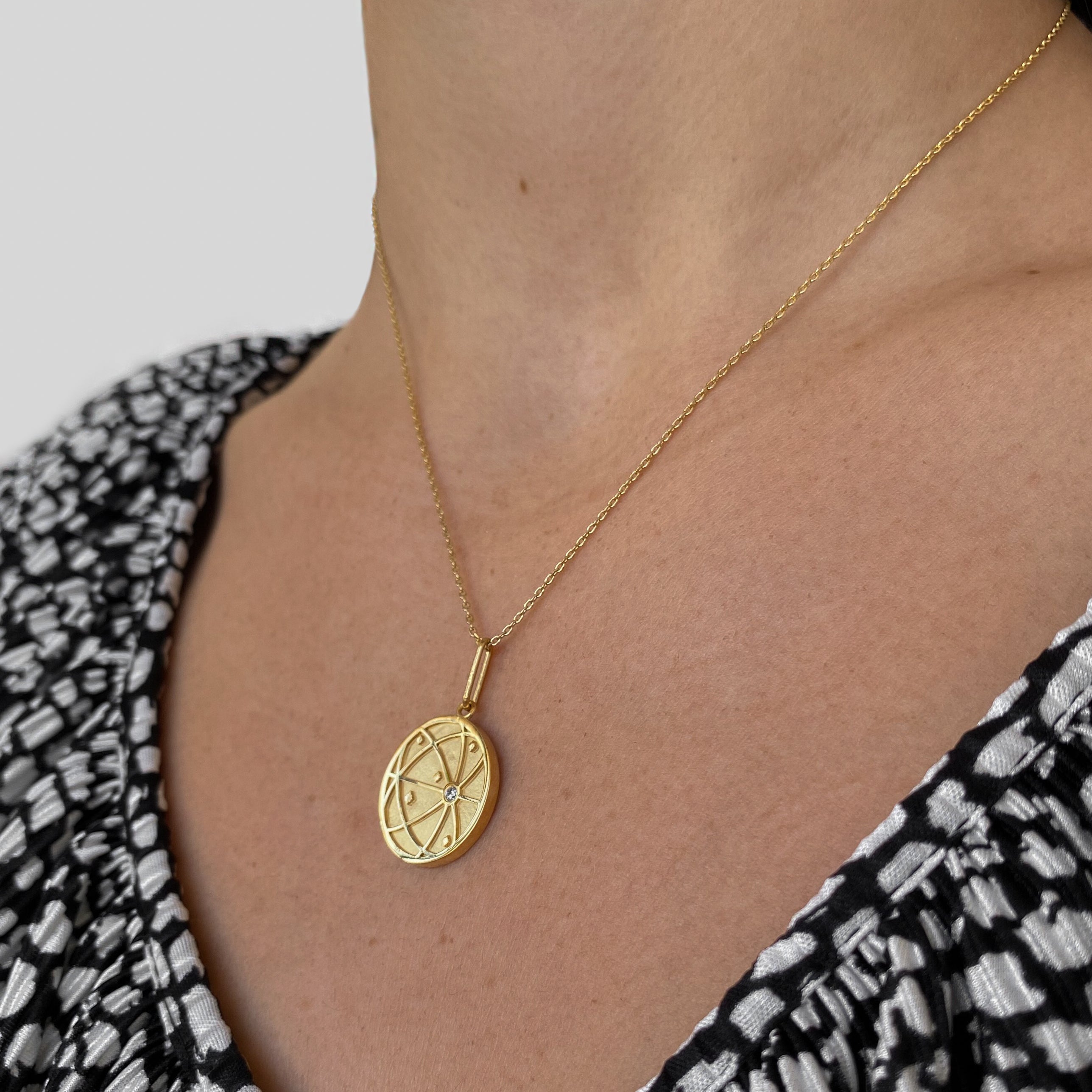 atlas coin pendant