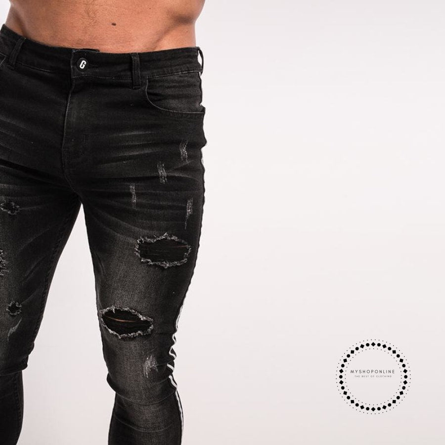 black ripped jeans designer