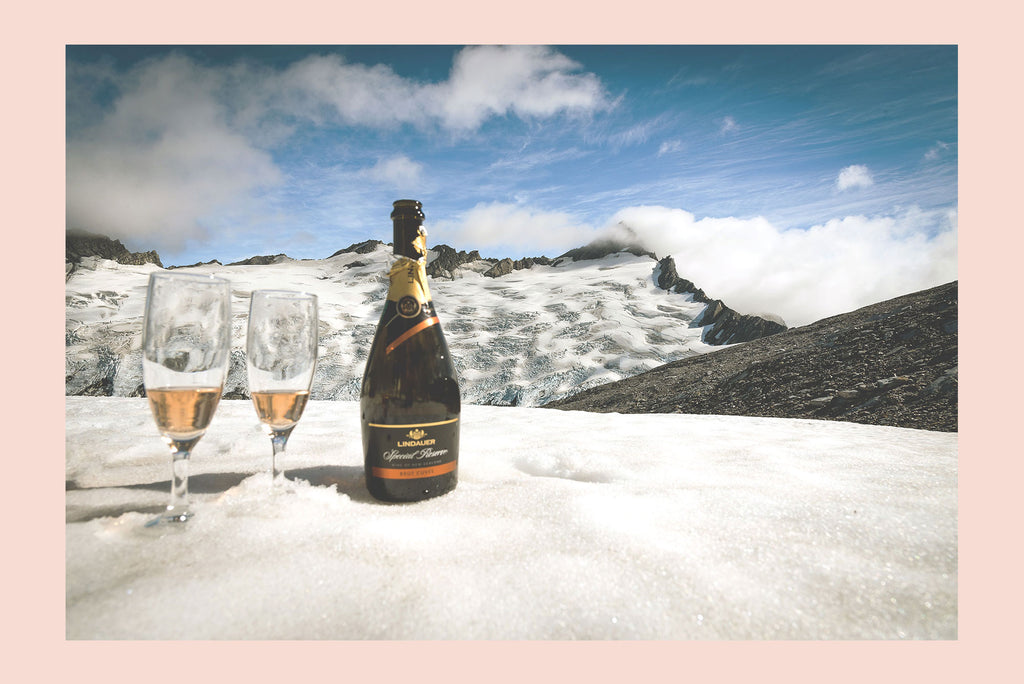 Champagne in the snow on the top of a mountain