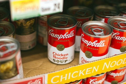 a close up of soup cans nonperishable food