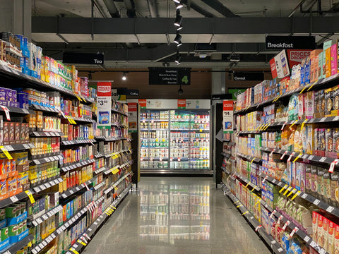 grocery store aisle stocked with food