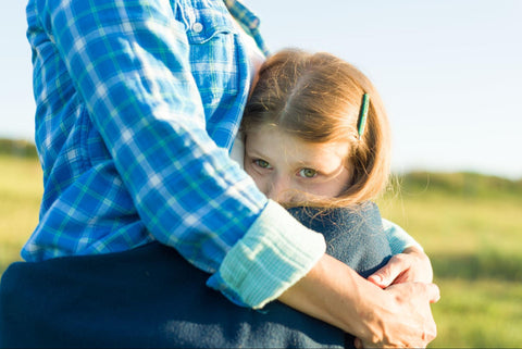 child and parent hugging