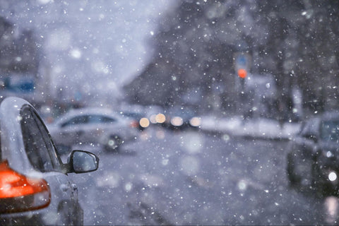 view from car of road during bad winter weather in city