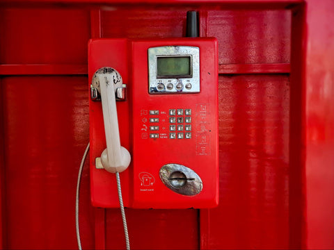 red corded landline telephone