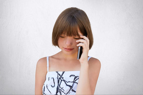 child communicating with her parents through an emergency phone