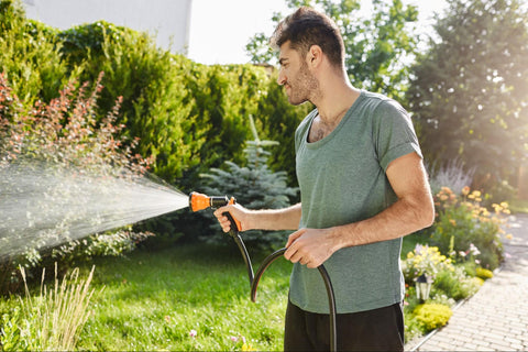 man watering plants