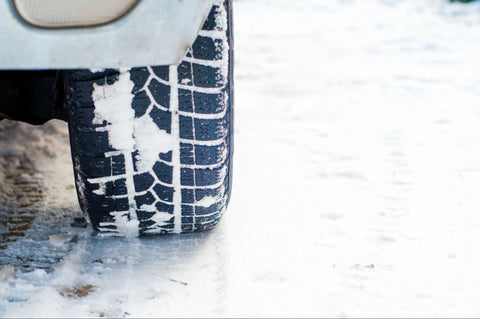 car tires on a snowy road