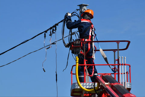 Worker fixing power lines