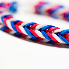 A USA-themed bracelet made from rubber bands as a 4th of July activity