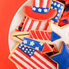 A plate of patriotic iced cookies for a 4th of July Dessert Idea