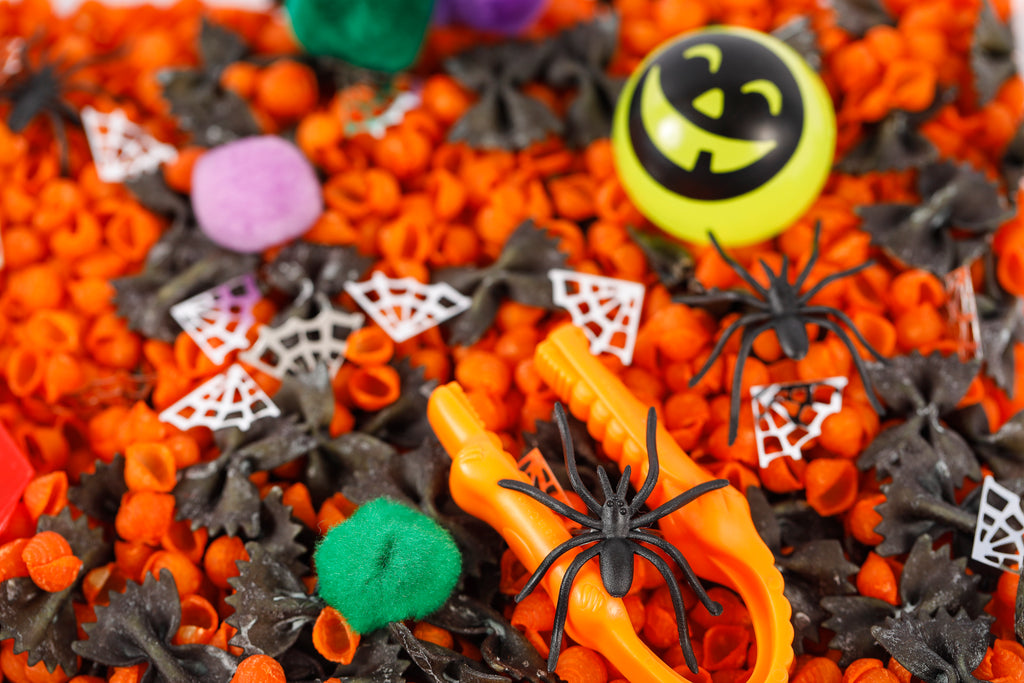 DIY Halloween sensory bin with spiders